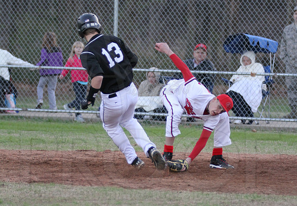 Glen Rose pitcher Lane Ballard trying to fake apply the tag at home (He lost the ball)