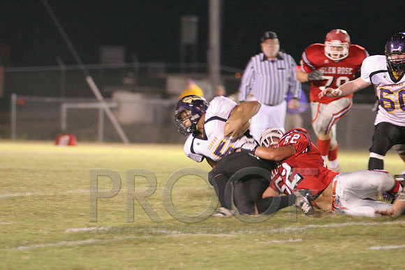 Sr. Chalie Young taking down RB Mark Maken.JPG