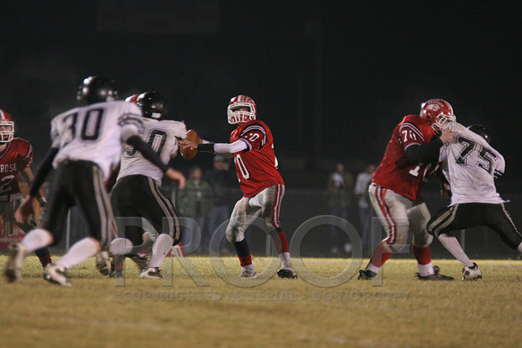 QB Ethan Holicer looking down field for Dylan Scroggins, the pass was picked off by Bauxite.jpg