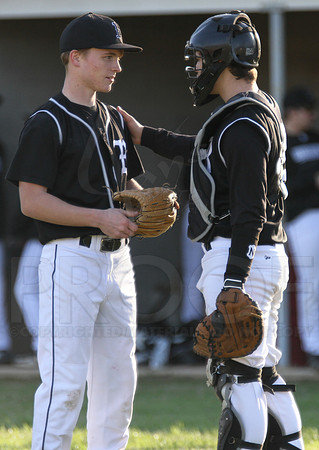 Bauxite catcher talking with the pitcher in between pitches
