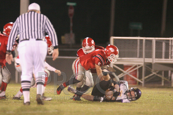 Jr. RB Dylan Ray running over a player.JPG