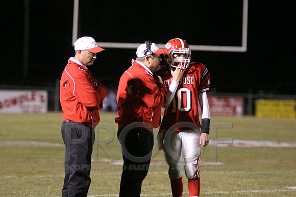 QB Ethan Holicer getting the play from his coaches.JPG