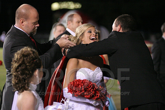 Homecoming Queen Jenna Henson along with her dad and brother.JPG